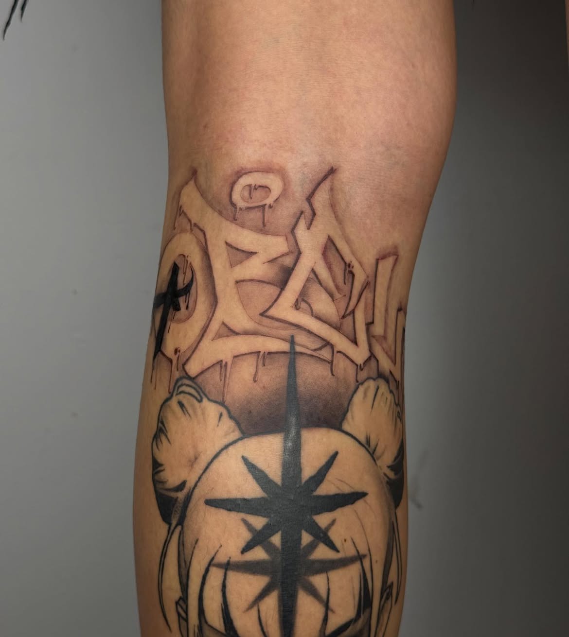 Black calligraphy tattoo by Groc at Sage tattoo shop, Tel Aviv