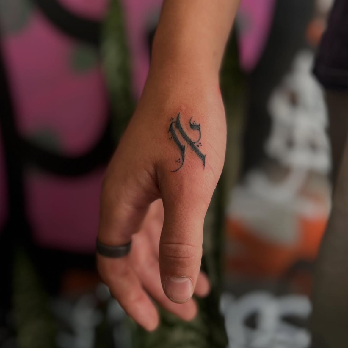 Bold script tattoo by Groc at a tattoo studio in Tel Aviv-Yaffo