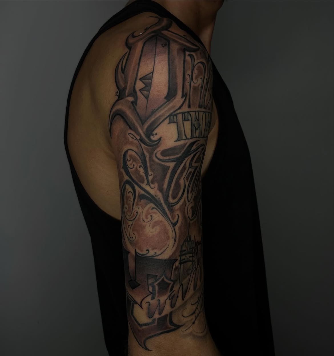 Black ink script tattoo by Groc, tattoo in Tel Aviv