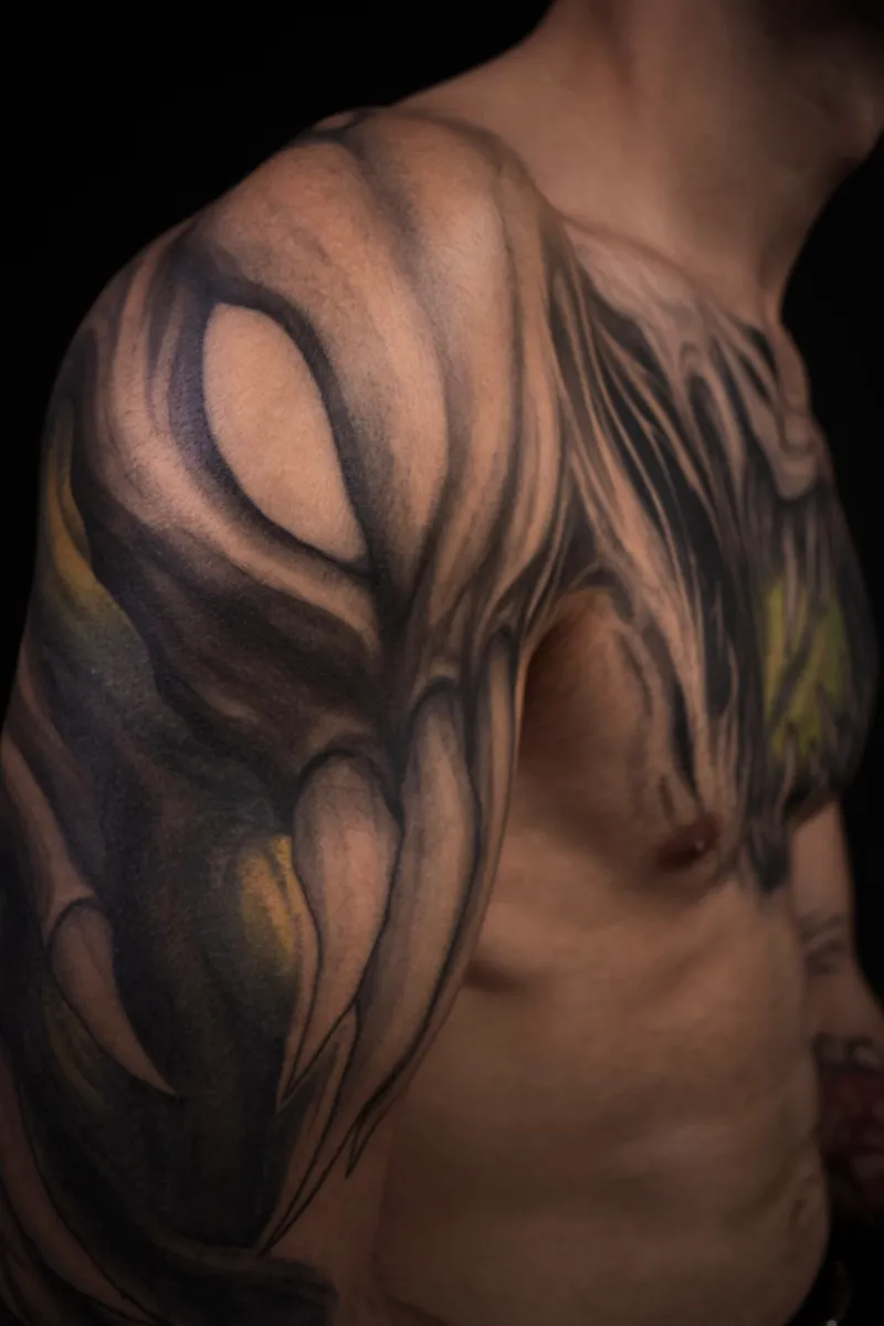 Engraved black tattoo by Lion at Sage Tattoo Studio Tel Aviv